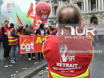 French General Confederation of Labour (CGT) unionists gather in front of Paris' Opera Garnier on December 20, 2017, to protest against Fren...