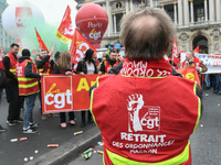 French General Confederation of Labour (CGT) unionists gather in front of Paris' Opera Garnier on December 20, 2017, to protest against Fren...