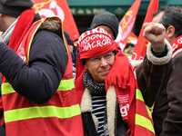 French General Confederation of Labour (CGT) unionists gather in front of Paris' Opera Garnier on December 20, 2017, to protest against Fren...