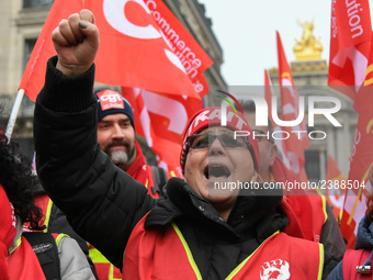 French General Confederation of Labour (CGT) unionists gather in front of Paris' Opera Garnier on December 20, 2017, to protest against Fren...