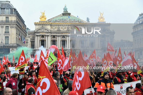 French General Confederation of Labour (CGT) unionists gather in front of Paris' Opera Garnier on December 20, 2017, to protest against Fren...