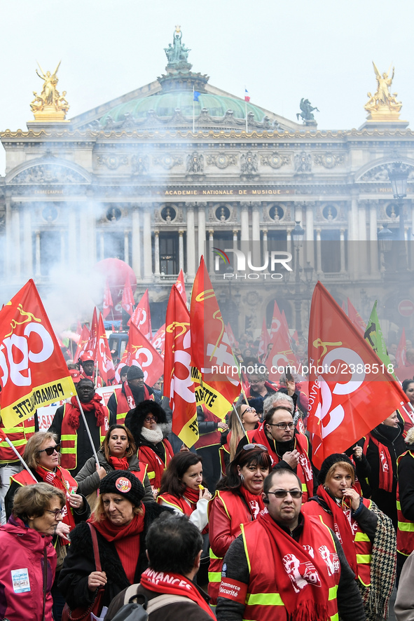 French General Confederation of Labour (CGT) unionists gather in front of Paris' Opera Garnier on December 20, 2017, to protest against Fren...