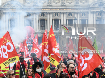 French General Confederation of Labour (CGT) unionists gather in front of Paris' Opera Garnier on December 20, 2017, to protest against Fren...