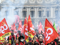 French General Confederation of Labour (CGT) unionists gather in front of Paris' Opera Garnier on December 20, 2017, to protest against Fren...