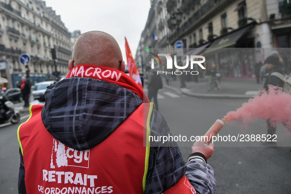 French General Confederation of Labour (CGT) unionists gather in front of Paris' Opera Garnier on December 20, 2017, to protest against Fren...