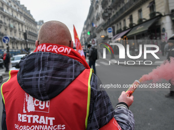 French General Confederation of Labour (CGT) unionists gather in front of Paris' Opera Garnier on December 20, 2017, to protest against Fren...