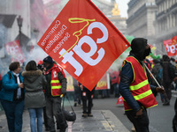 People marched through the streets of Paris during a demonstration called by French General Confederation of Labour (CGT) union on December...