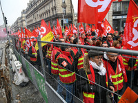 People marched through the streets of Paris during a demonstration called by French General Confederation of Labour (CGT) union on December...