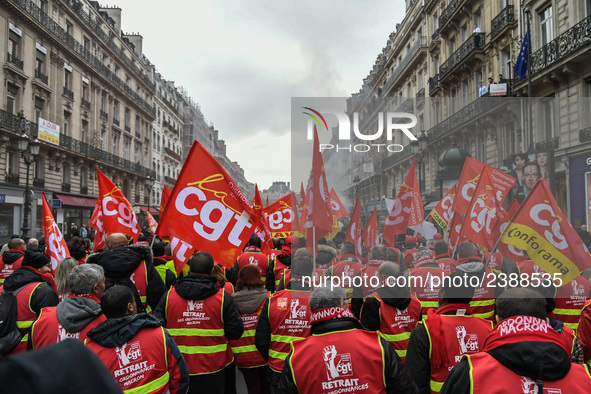 People marched through the streets of Paris during a demonstration called by French General Confederation of Labour (CGT) union on December...