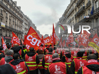 People marched through the streets of Paris during a demonstration called by French General Confederation of Labour (CGT) union on December...