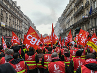 People marched through the streets of Paris during a demonstration called by French General Confederation of Labour (CGT) union on December...