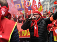 People marched through the streets of Paris during a demonstration called by French General Confederation of Labour (CGT) union on December...