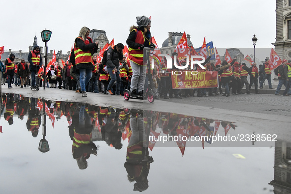 People marched through the streets of Paris during a demonstration called by French General Confederation of Labour (CGT) union on December...