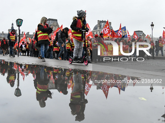 People marched through the streets of Paris during a demonstration called by French General Confederation of Labour (CGT) union on December...