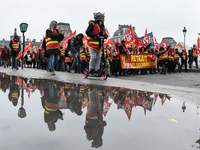 People marched through the streets of Paris during a demonstration called by French General Confederation of Labour (CGT) union on December...