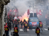 People marched through the streets of Paris during a demonstration called by French General Confederation of Labour (CGT) union on December...