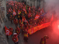 People during a demonstration called by French General Confederation of Labour (CGT) union on December 20, 2017 in Paris to protest against...