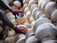 A pottery maker take out the clay pottery from the burning section in Kuala Selangor, Malaysia .  (