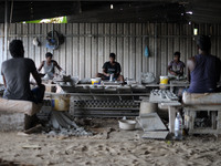 A pottery maker produces a clay lantern or ‘diya’ in Kuala Selangor, Malaysia. Diyas are the small earthen lamps primarily used during Diwal...