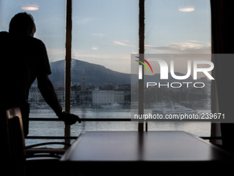 A pilgrim inside a cruise ship sees the city of Split, Croatia. Many italian pilgrims travel via cruise ship from Ancona, Italy to Split, Cr...