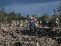 Pilgrims on a steep path that leads on the very place of the apparitions of Our Lady,  called Podbrdo and Apparition Hill. Almost one millio...