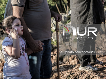 A girl with her father on a steep path that leads on the very place of the apparitions of Our Lady,  called Podbrdo and Apparition Hill.Almo...