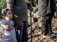 A girl with her father on a steep path that leads on the very place of the apparitions of Our Lady,  called Podbrdo and Apparition Hill.Almo...