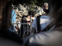 A pilgrim near the statue of Virgin Mary on the the Apparition Hill, in Medjugorje. Almost one million people visit Medjugorje each year, wh...