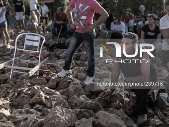 A pilgrim prays in front of statue of Virgin Mary on the the Apparition Hill, in Medjugorje. Almost one million people visit Medjugorje each...