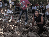 A pilgrim prays in front of statue of Virgin Mary on the the Apparition Hill, in Medjugorje. Almost one million people visit Medjugorje each...