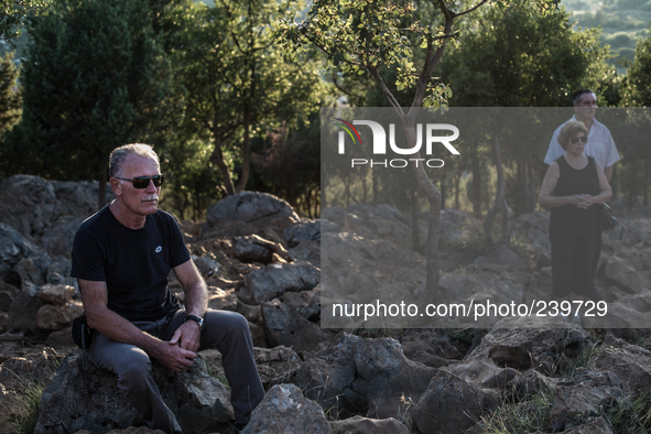 A pilgrim prays in front of statue of Virgin Mary on the the Apparition Hill, in Medjugorje. Almost one million people visit Medjugorje each...