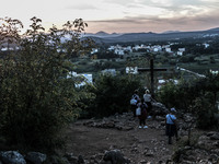 A cross on a steep path that leads on the very place of the apparitions of Our Lady, called Podbrdo and Apparition Hill. On the way towards...