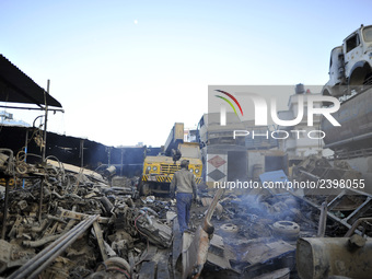 A worker searching for Iron materials at Sanepa, Lalitpur, Nepal on Friday, December 29, 2017.  (