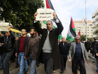 A march in support of the rights of Palestinian employees, hired by the former Hamas government in Gaza, demanding their rights and integrat...