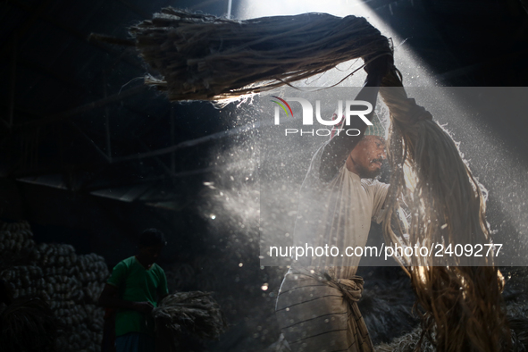 A jute worker works in a jute processing factory in Narayanganj, Bangladesh. January 7, 2018 