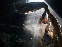 A jute worker works in a jute processing factory in Narayanganj, Bangladesh. January 7, 2018 (