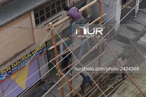 Labourers work at New Road contraction at howrah district ,around 16 kms West of Kolkata on January 15,2018 in Kolkata,India. 