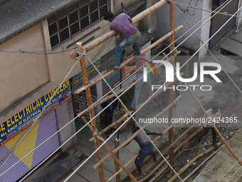 Labourers work at New Road contraction at howrah district ,around 16 kms West of Kolkata on January 15,2018 in Kolkata,India. (