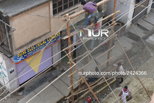 Labourers work at New Road contraction at howrah district ,around 16 kms West of Kolkata on January 15,2018 in Kolkata,India. 