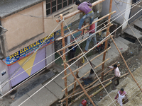 Labourers work at New Road contraction at howrah district ,around 16 kms West of Kolkata on January 15,2018 in Kolkata,India. (