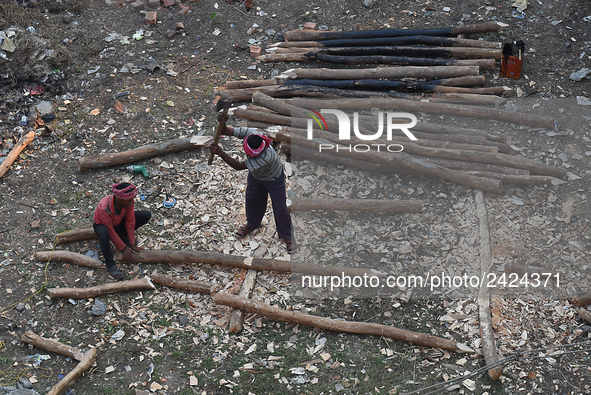 Labourers work at New Road contraction at howrah district ,around 16 kms West of Kolkata on January 15,2018 in Kolkata,India. 