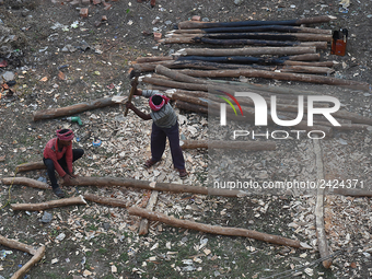 Labourers work at New Road contraction at howrah district ,around 16 kms West of Kolkata on January 15,2018 in Kolkata,India. (