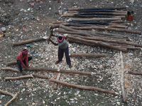 Labourers work at New Road contraction at howrah district ,around 16 kms West of Kolkata on January 15,2018 in Kolkata,India. (