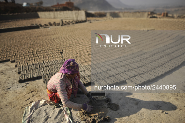 38 yrs old, KALIMAYA PARI making raw bricks at a brick factory in Lalitpur, Nepal on Tuesday, January 23, 2018. She used to make 600 - 700 b...