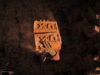 A Migrant Indian labourer stacks bricks by balancing them onto his head at a brick factory in Lalitpur, Nepal on Tuesday, January 23, 2018....