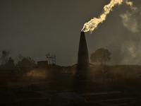 A view of Brick Kilns with chimney and smoke in Lalitpur, Nepal on Tuesday, January 23, 2018. (