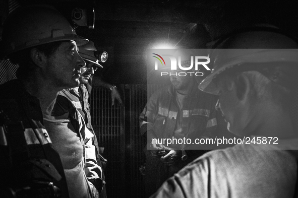 Italy, Sardinia 2013 Few miners in the lift tools used to go rapidly into the mine, 5 minutes is also the time  that it takes to reach the s...