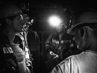 Italy, Sardinia 2013 Few miners in the lift tools used to go rapidly into the mine, 5 minutes is also the time  that it takes to reach the s...