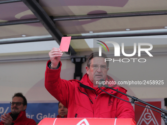 Jürgen Wechsler showing the red card taking part in a strike at a BMW factory site in Munich, Germany, 2 February 2017. A few thousand came...