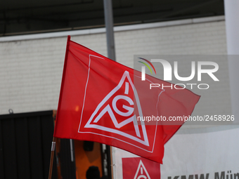 IG Metall is seen during a strike at a BMW factory site in Munich, Germany, 2 February 2017.. A few thousand came to the rally in front of t...